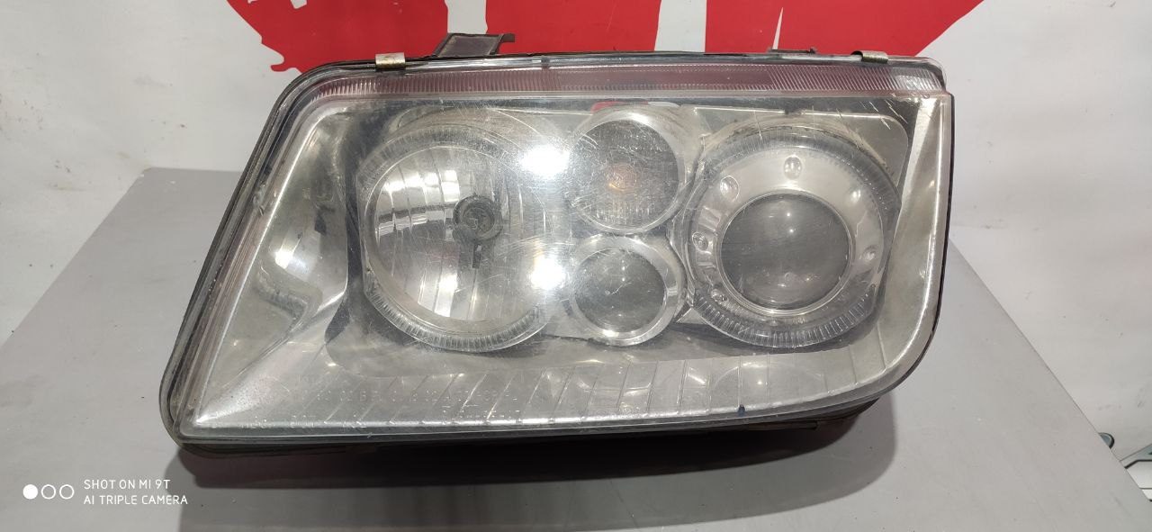 Ліва фара Volkswagen Bora